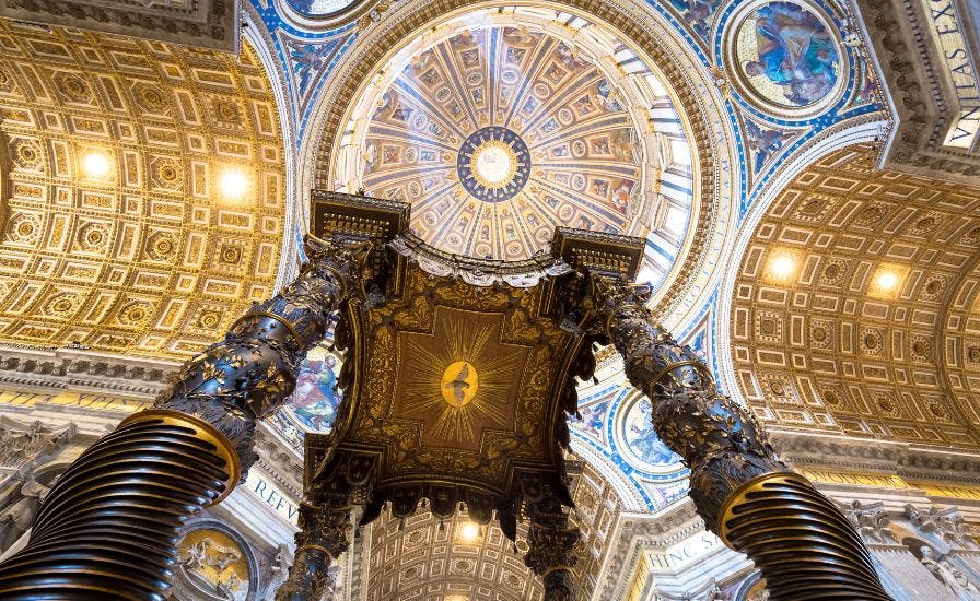 Interior-of-the-Dome-at-St.-Peter's-Basilica-showcasing-intricate-architecture-and-beautiful-artwork