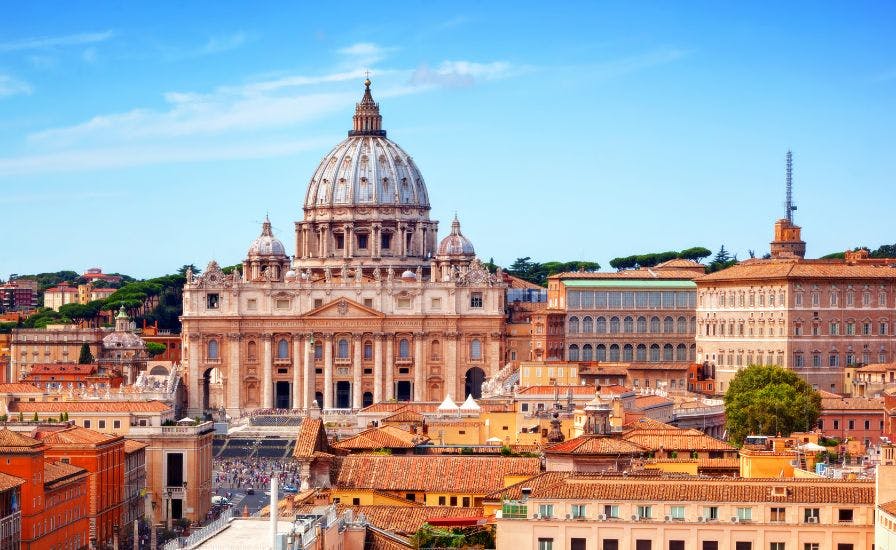 Aerial view of Rome, Italy with St. Peter's Basilica in the foreground, showcasing the city's rich history and architectural beauty.