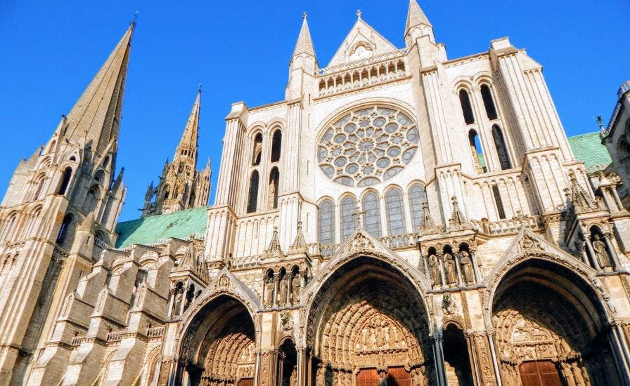 Exterior view of Chartres Cathedral, a stunning example of French Gothic architecture with intricate stained glass windows
