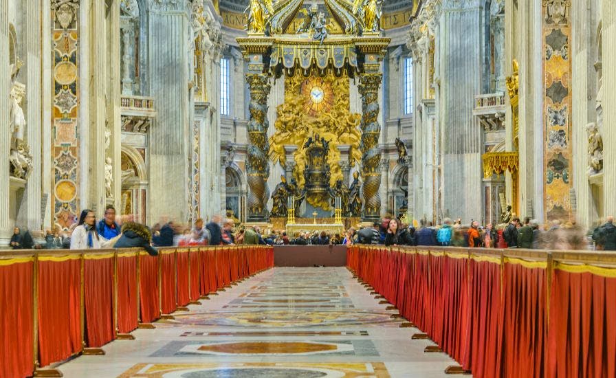 Interior of St. Peter Basilica with red curtain.
