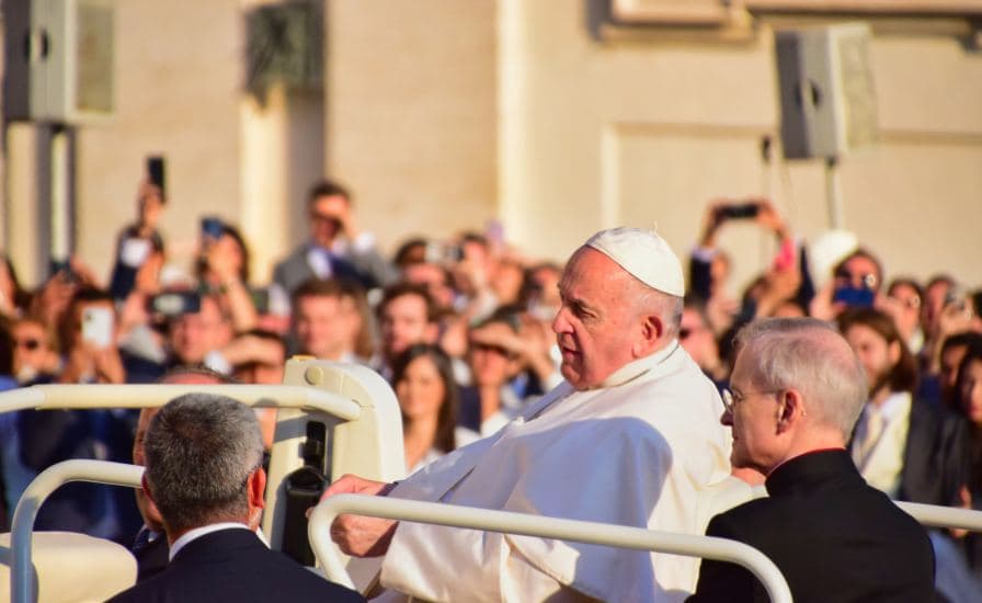 Pope Francis waves to the crowd at the end of his general audience during Canonization Ceremonies.