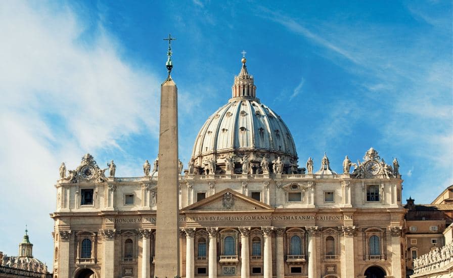 Iconic Vatican structure featuring towering obelisk, representing Catholicism in Rome